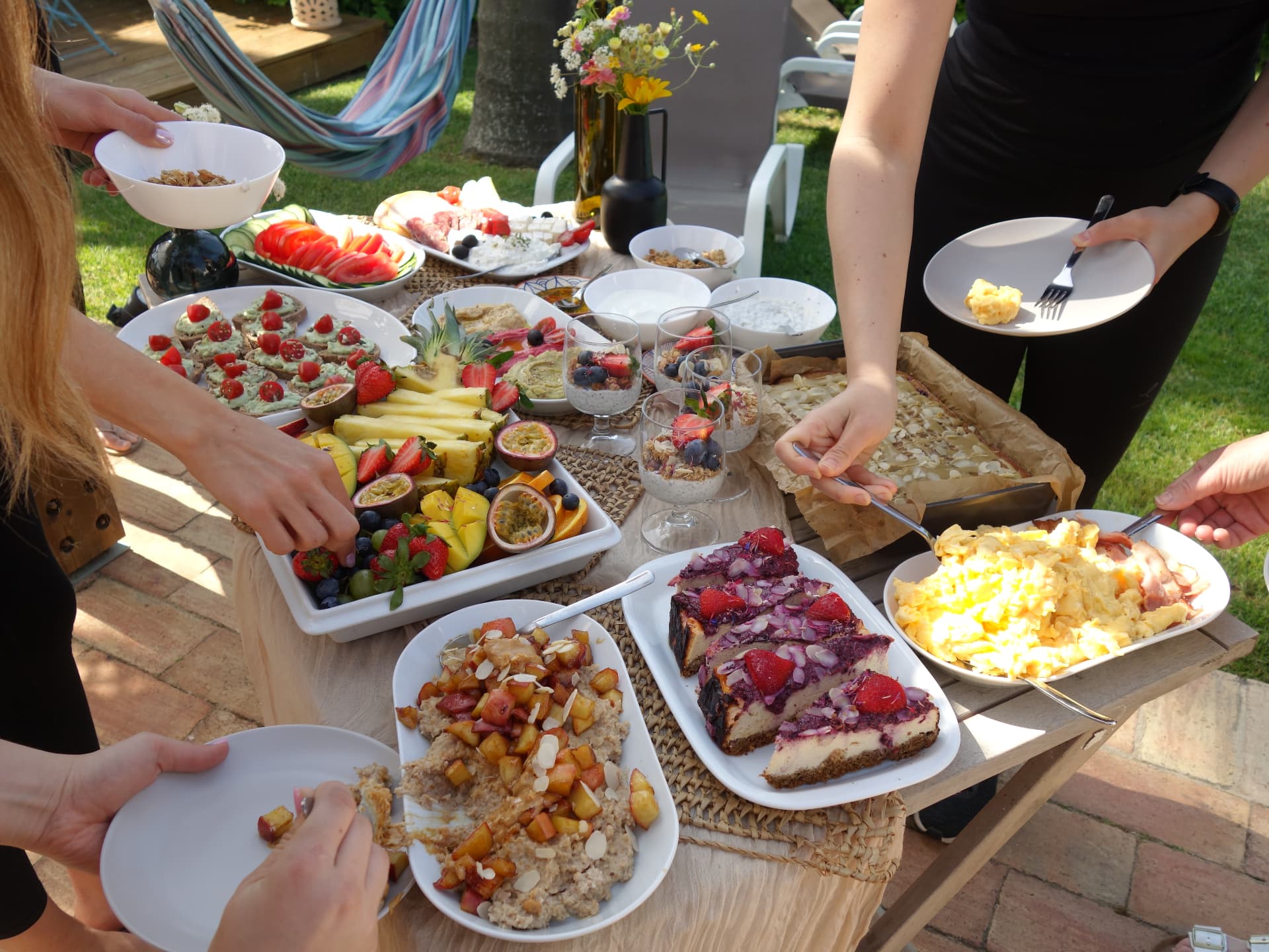 Guests sharing a colourful brunch table on retreat